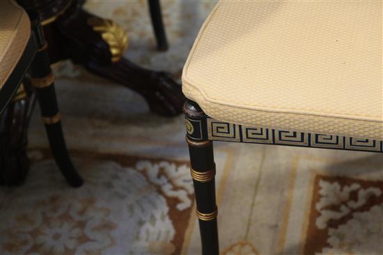 A set of eight Regency style parcel gilt ebonised dining chairs, including two carvers, carvers W.1ft 9in. H.2ft 9in.